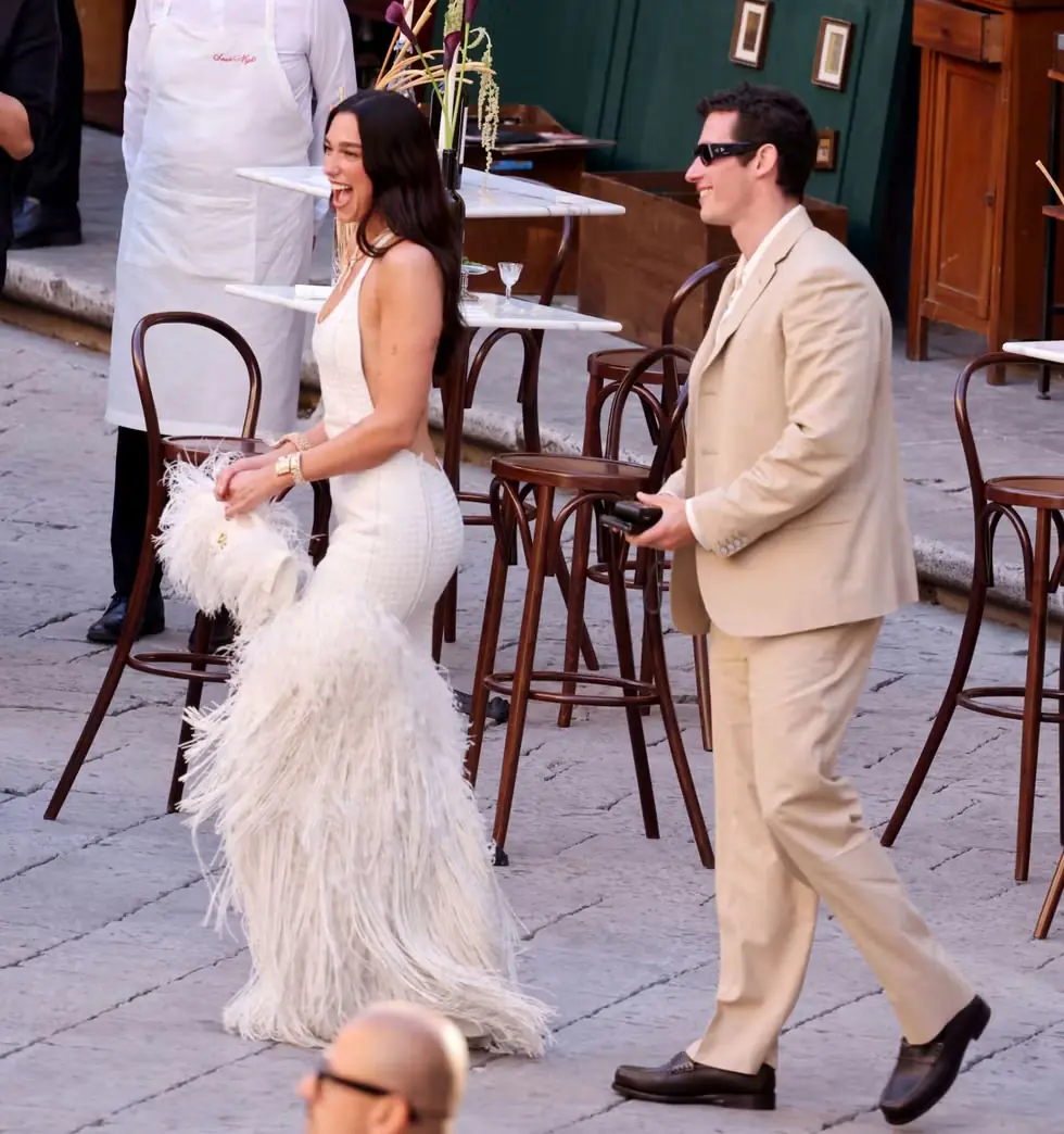 Dua Lipa in custom white feathered Bottega Veneta gown at her Palermo Italy wedding welcome dinner 2026