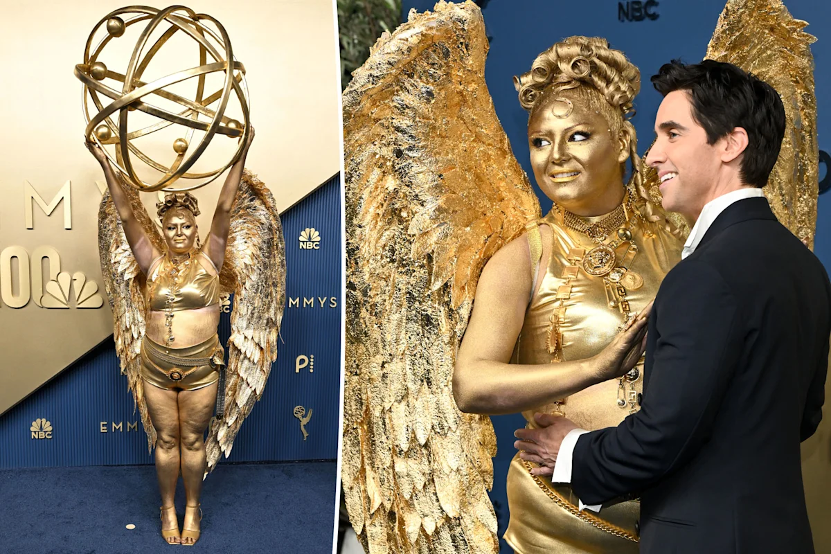 Megan Stalter dressed as an Emmy statuette on the red carpet