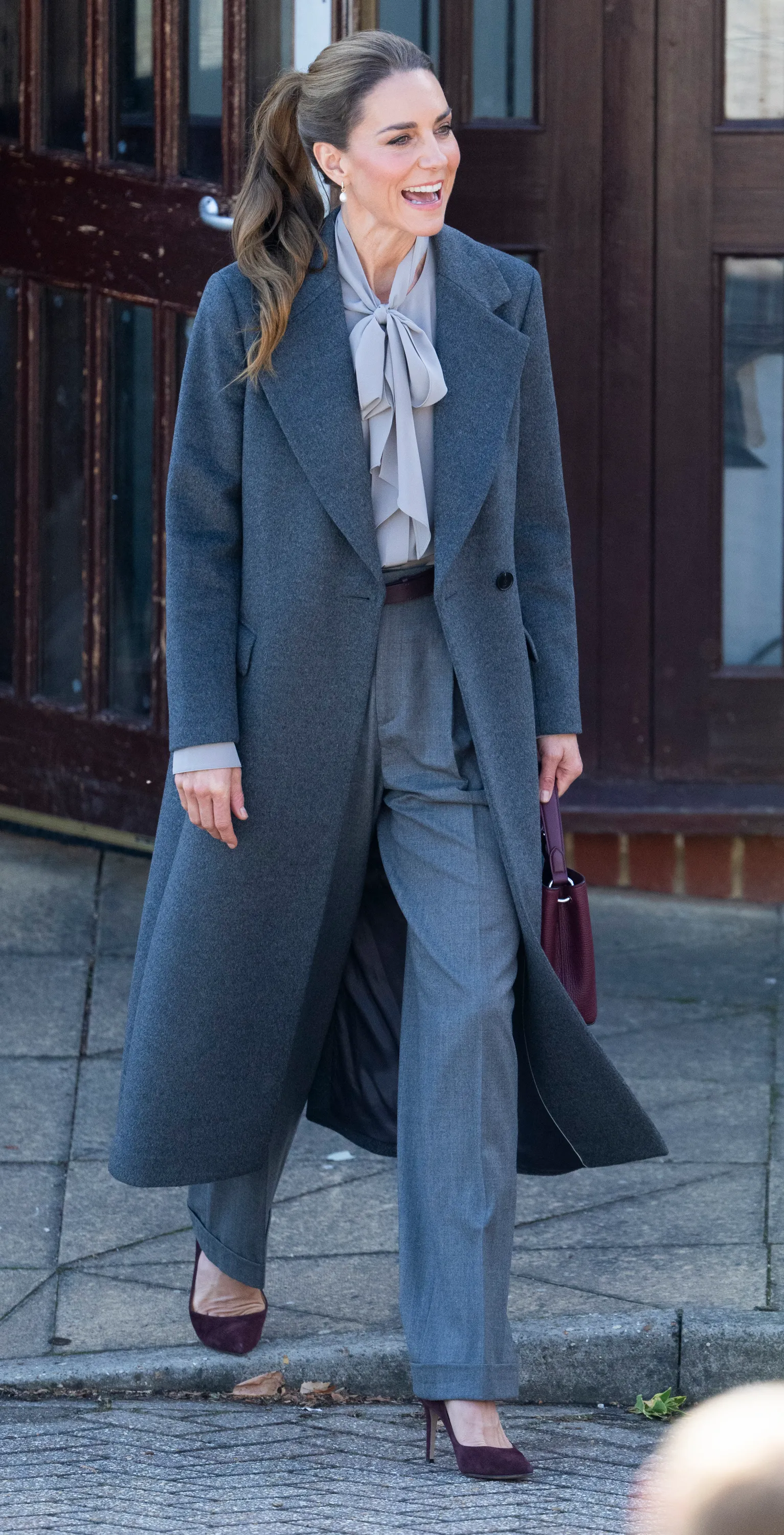 Princess of Wales carrying a maroon Smythson bag and wearing burgundy Gianvito Rossi pumps